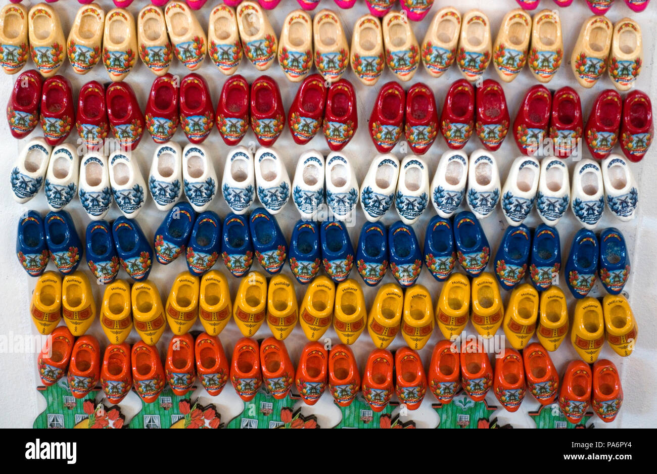 Small Dutch wooden shoes in the colors of the Dutch National flag. In a souvenir shop in Delft, the Netherlands Stock Photo