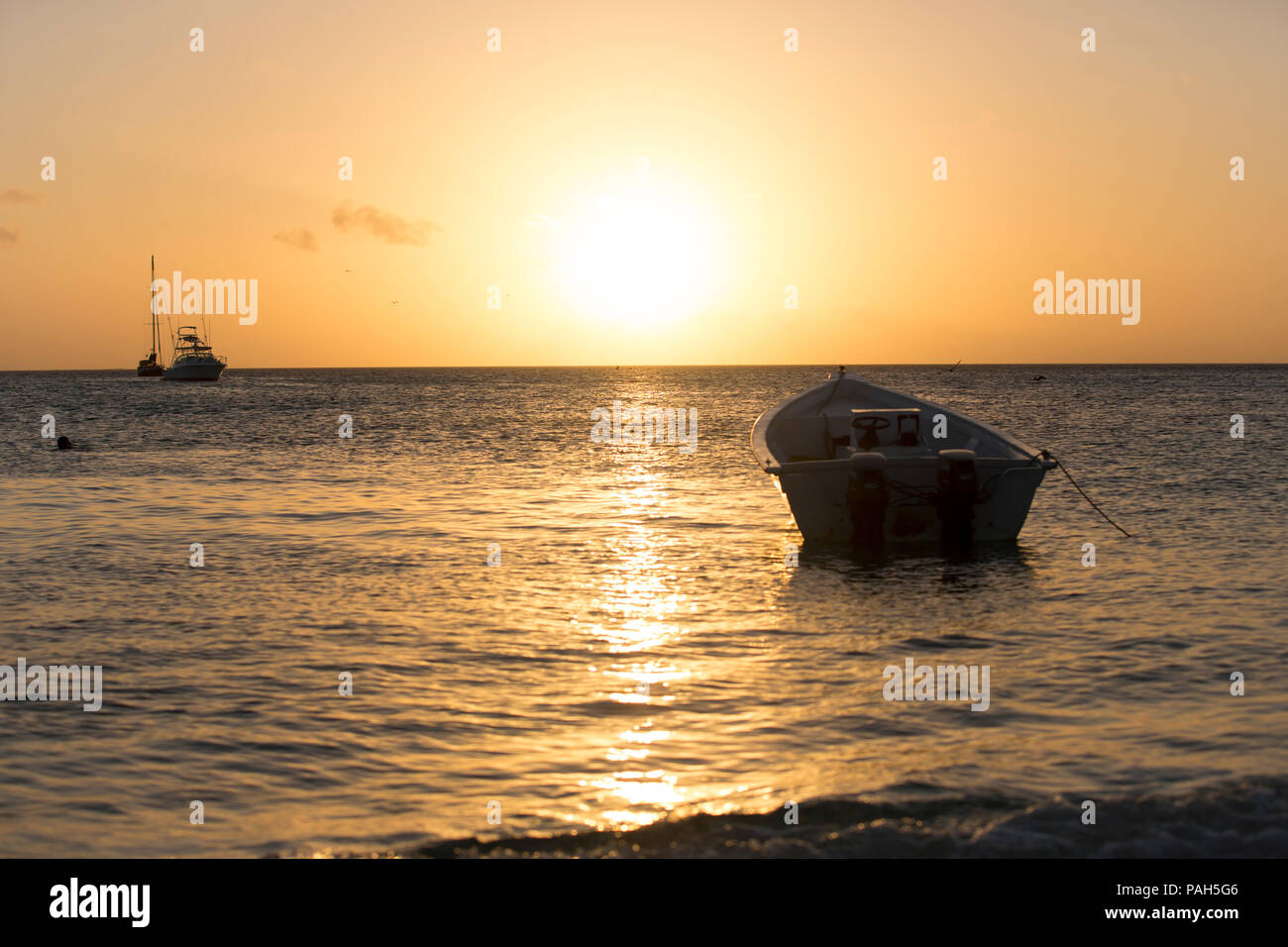 Boats in the sunset, Los Roques Islands, Venezuela Stock Photo