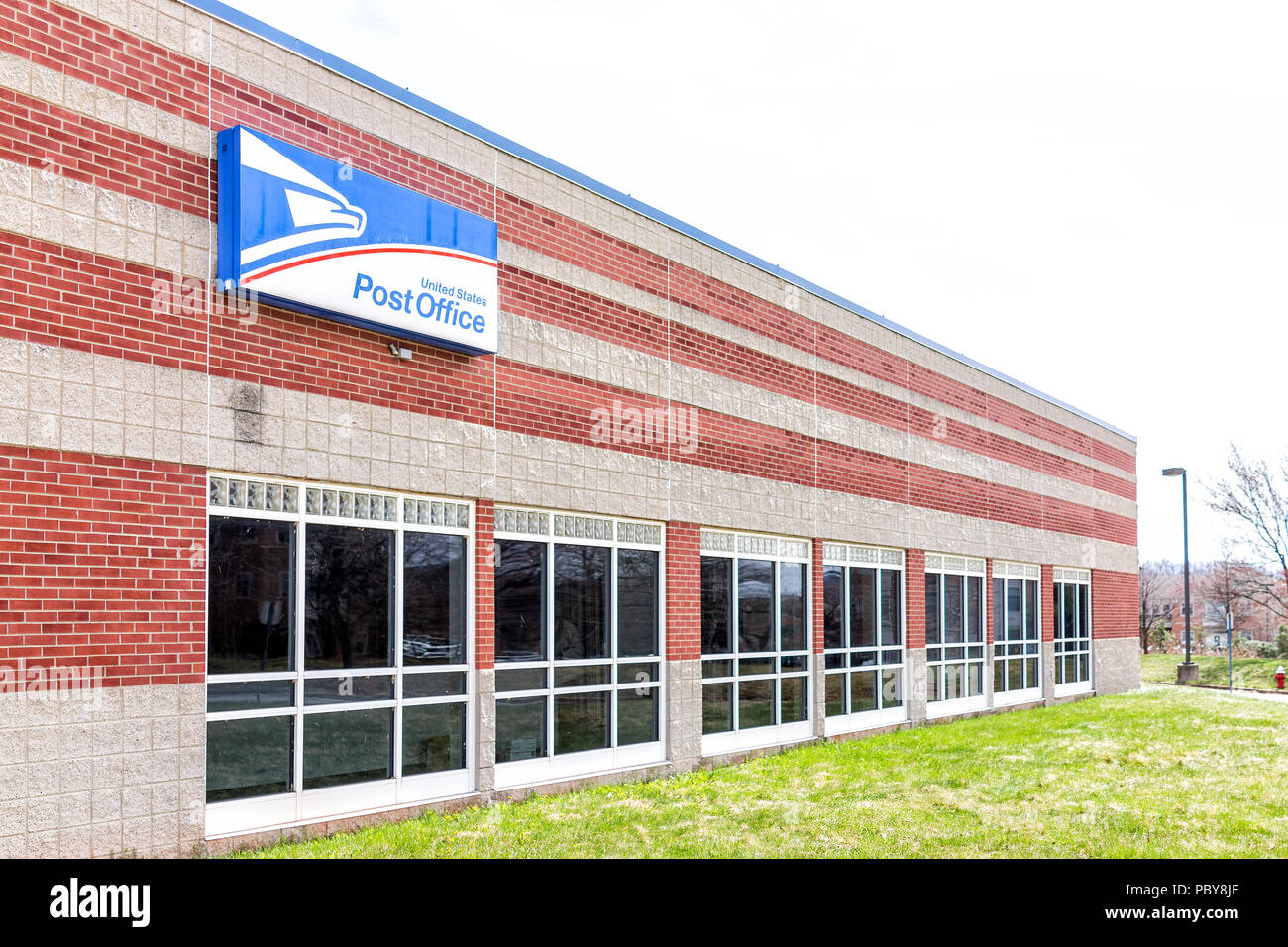 Sterling, USA - April 4, 2018: United States Postal Service USPS office exterior in Loudoun County, Virginia with nobody, sign, blue logo Stock Photo