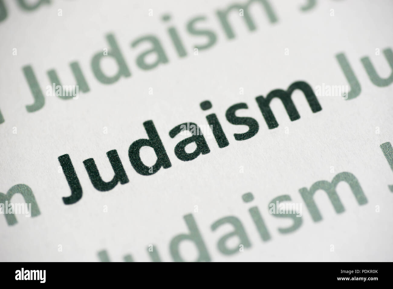 word Judaism printed on white paper macro Stock Photo