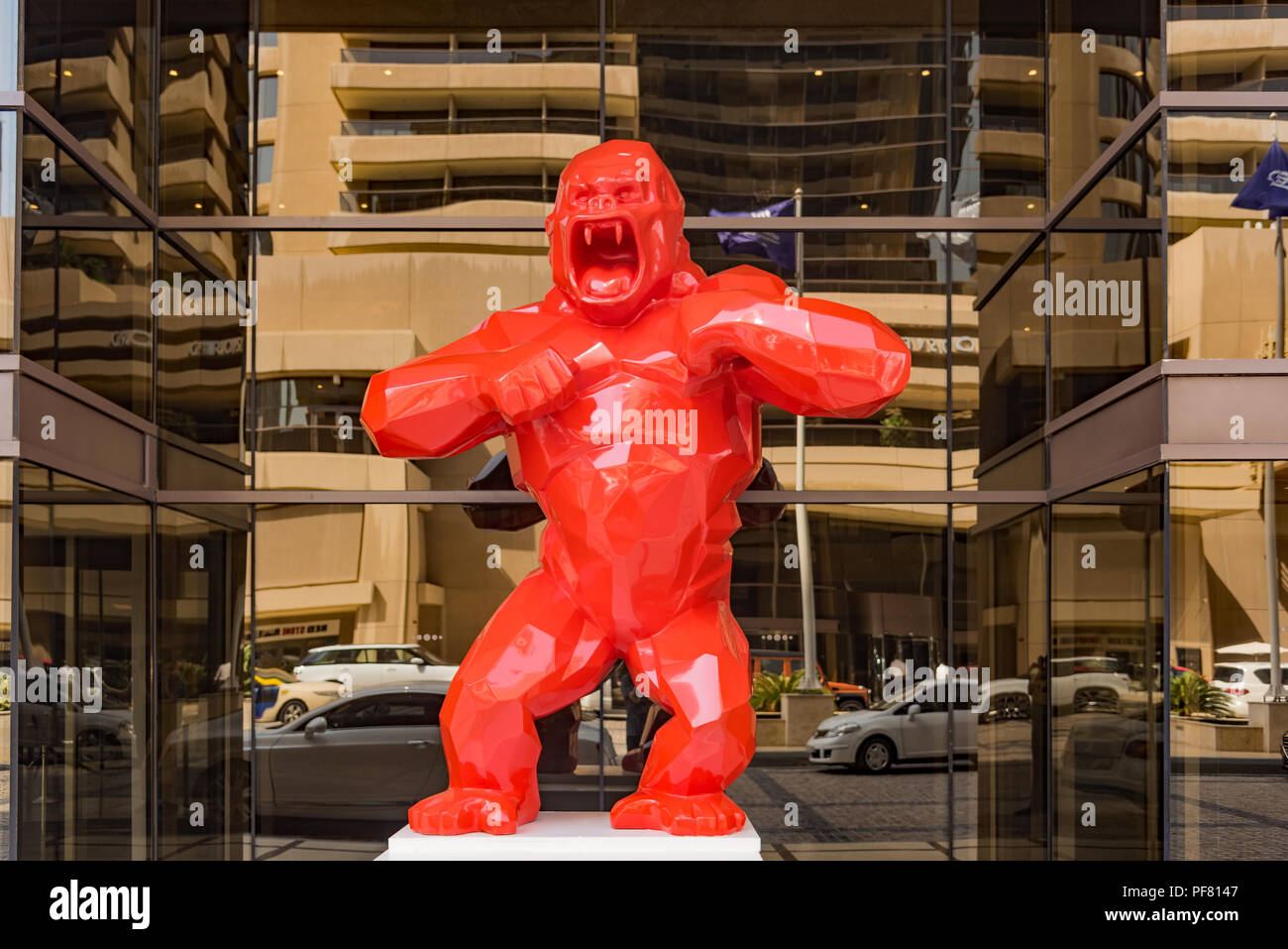 Red King Kong spotted outside a hotel somewhere in Dubai. Stock Photo