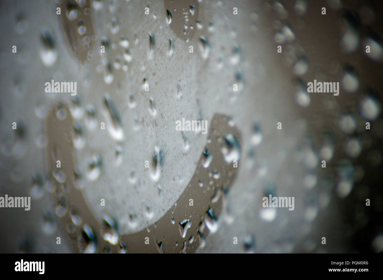 Positive Attitude Concept: Happy Smile Emoji On The Foggy Window With Water Drops On A Rainy Day Stock Photo