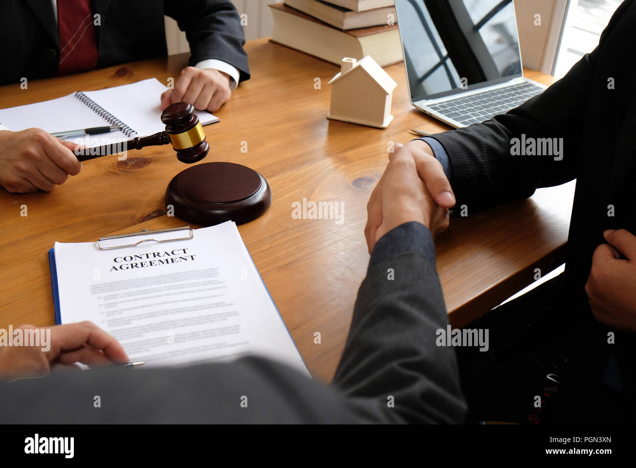 businessman shaking hands with lawyer after discussing auction contract agreement. handshaking after meeting at law firm. Stock Photo