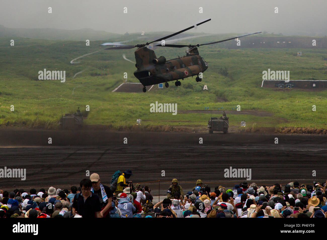 COMBINED ARMS TRAINING CENTER CAMP FUJI, GOTEMBA, Japan –A CH-47 Chinook helicopter takes off during the annual Fuji Firepower Demonstration Aug. 26 on Combined Arms Training Center Camp Fuji, Gotemba, Japan. The demonstration brought members of the local and U.S. communities together to observe and gain a better understanding of their capabilities in regards to the defense of Japan. Each year more of the public is educated, which in turn builds confidence in the precision, skill sets, and proficiency of the JGSDF. (U.S. Marine Corps photo by Pfc. Nicole Rogge) Stock Photo