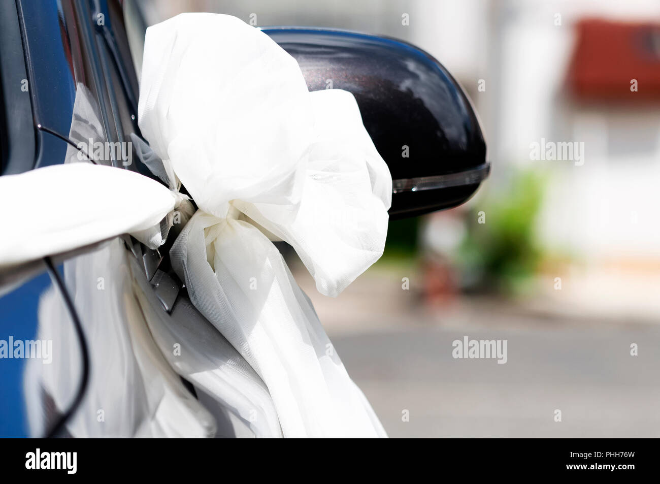 Wedding bow on car Stock Photo - Alamy