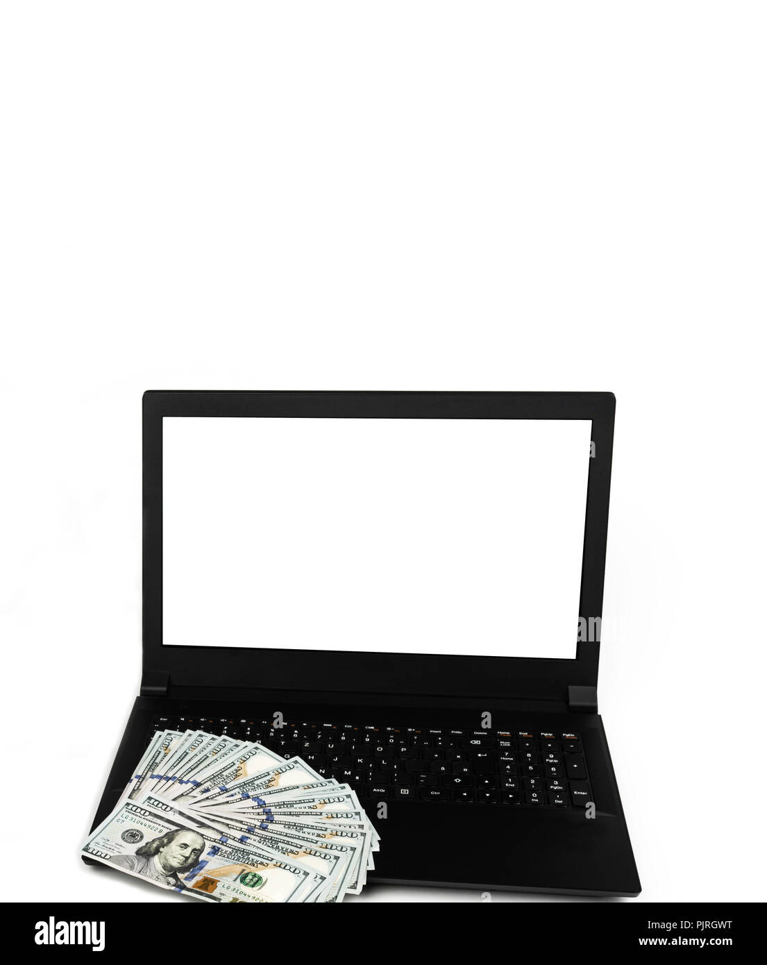 Laptop or notebook with widespread of cash one hundred dollar bills isolated on white background with clean blank display. Template, mock up. Stock Photo