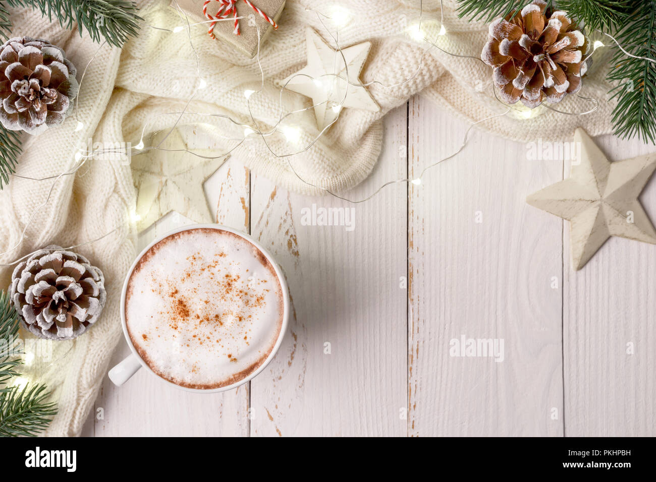 Winter holidays background with cup of hot coffee, wish list and ...