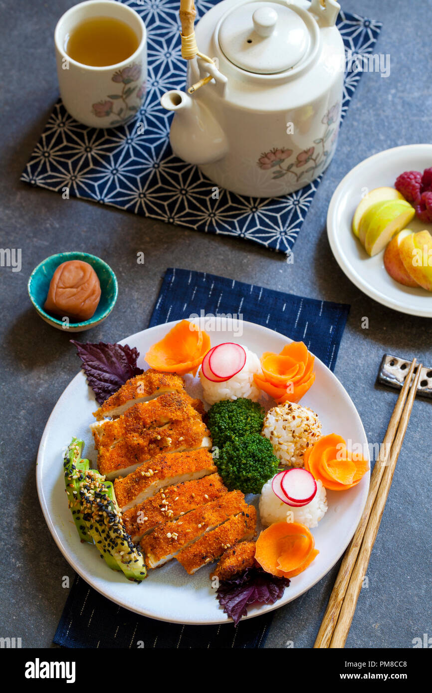 Japanese style  lunch with onigiri rice balls and crispy chicken Stock Photo