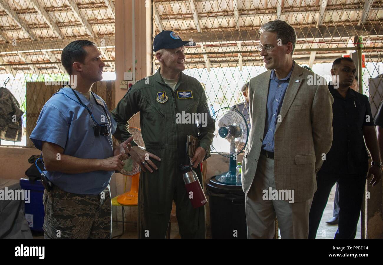 U.S. Air Force Lt. Col. Gary Mayne, 18th Dental Squadron dentist, Kadena Air Base, Japan, briefs U.S. Air Force Maj. Gen. James Eifert, Air National Guard assistant to the Commander, Pacific Air Forces and Robert Hilton, Chargé d’Affaires of the U.S. Embassy to Sri Lanka, on the dental outreach of Pacific Angel (PAC ANGEL) 18-4 in Vavuniya, Sri Lanka, Aug. 17, 2018. PAC ANGEL 18 is a joint and combined engagement that enhances participating nations’ humanitarian assistance and disaster relief capabilities while providing beneficial services to people in need throughout South and Southeast Asia Stock Photo