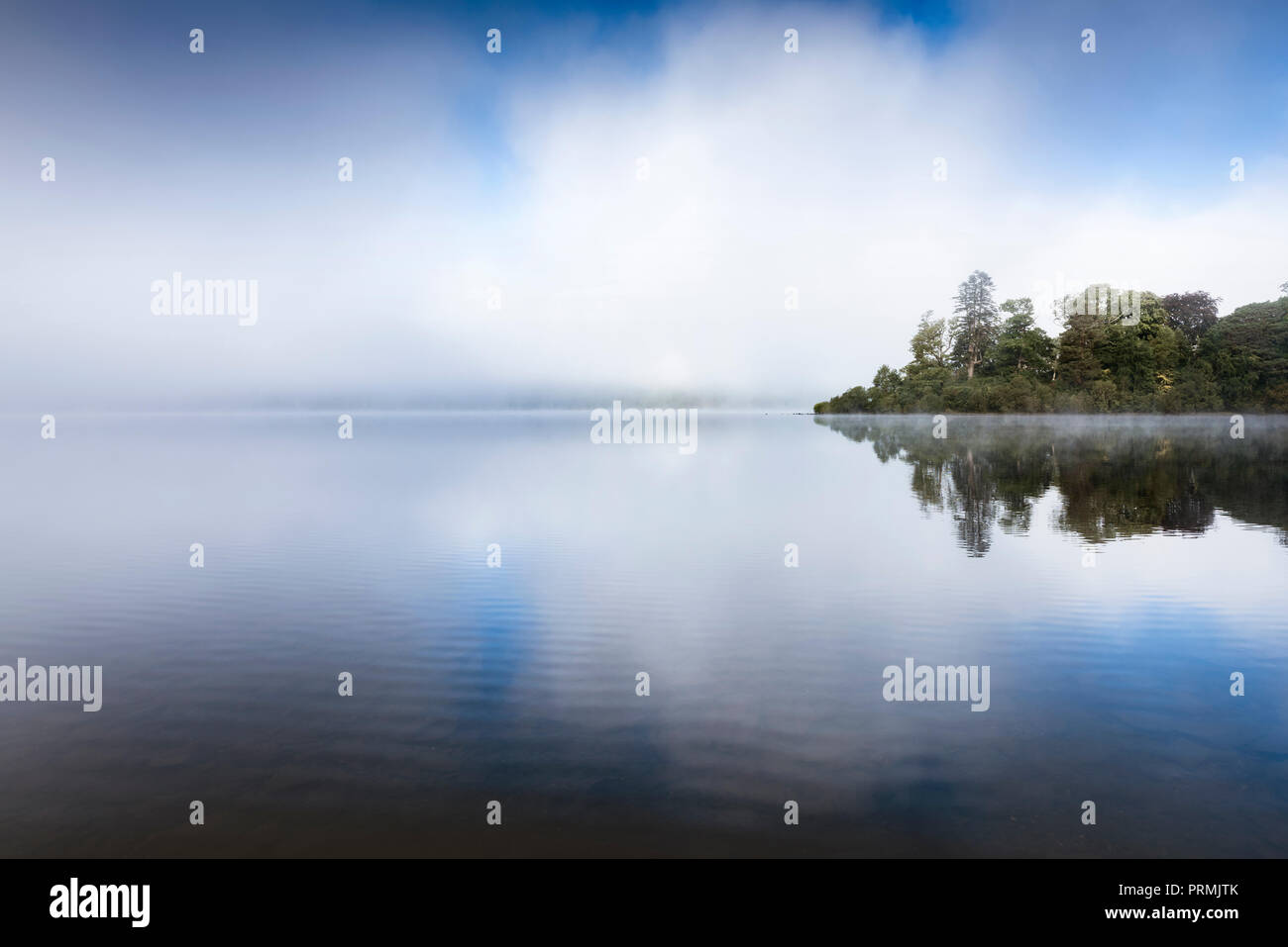 Mist rising over the lake at Derwent Water near Keswick in the English lake District Stock Photo