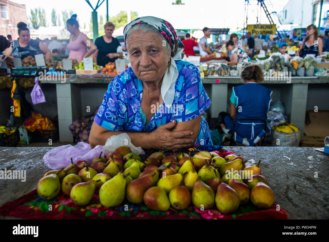 Woman selling apples on a local market, Tiraspol, Republic of Transnistria, Moldova Stock Photo