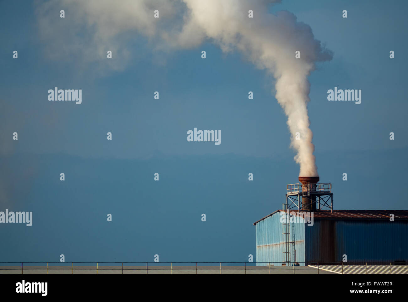 Factory smokestack, long shot Stock Photo