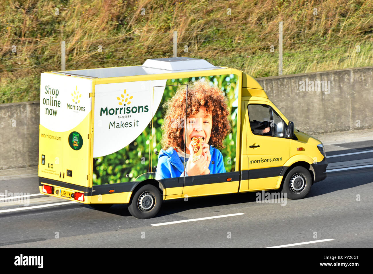 Side of colourful Morrisons internet food grocery supply chain supermarket delivery van home supply service to online food shopping customers Essex UK Stock Photo