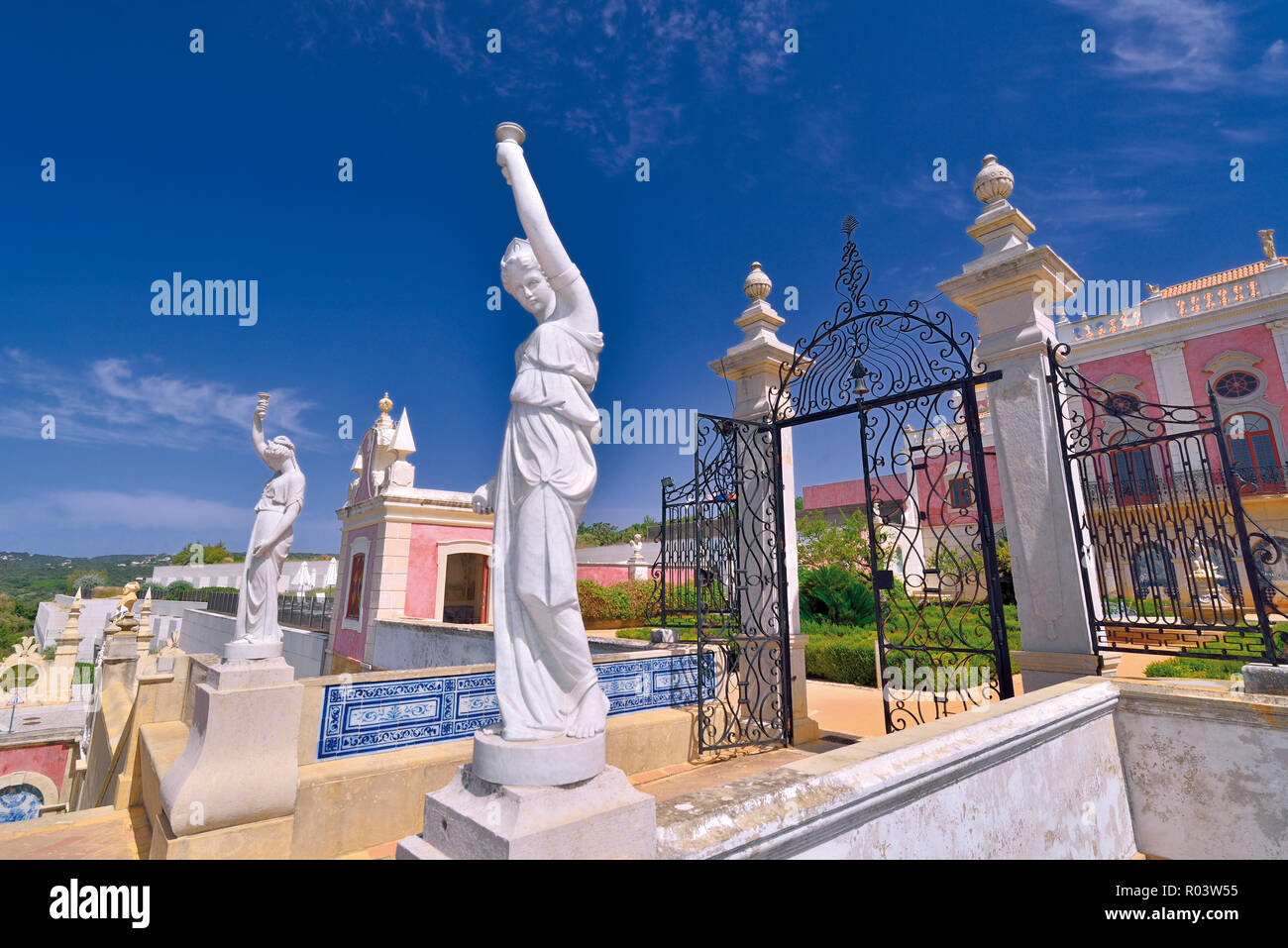 White marble statues and park with rokoko palace Stock Photo