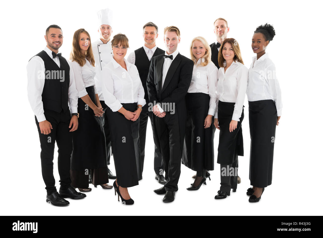 Portrait Of Confident Restaurant Staff Standing In Row Stock Photo