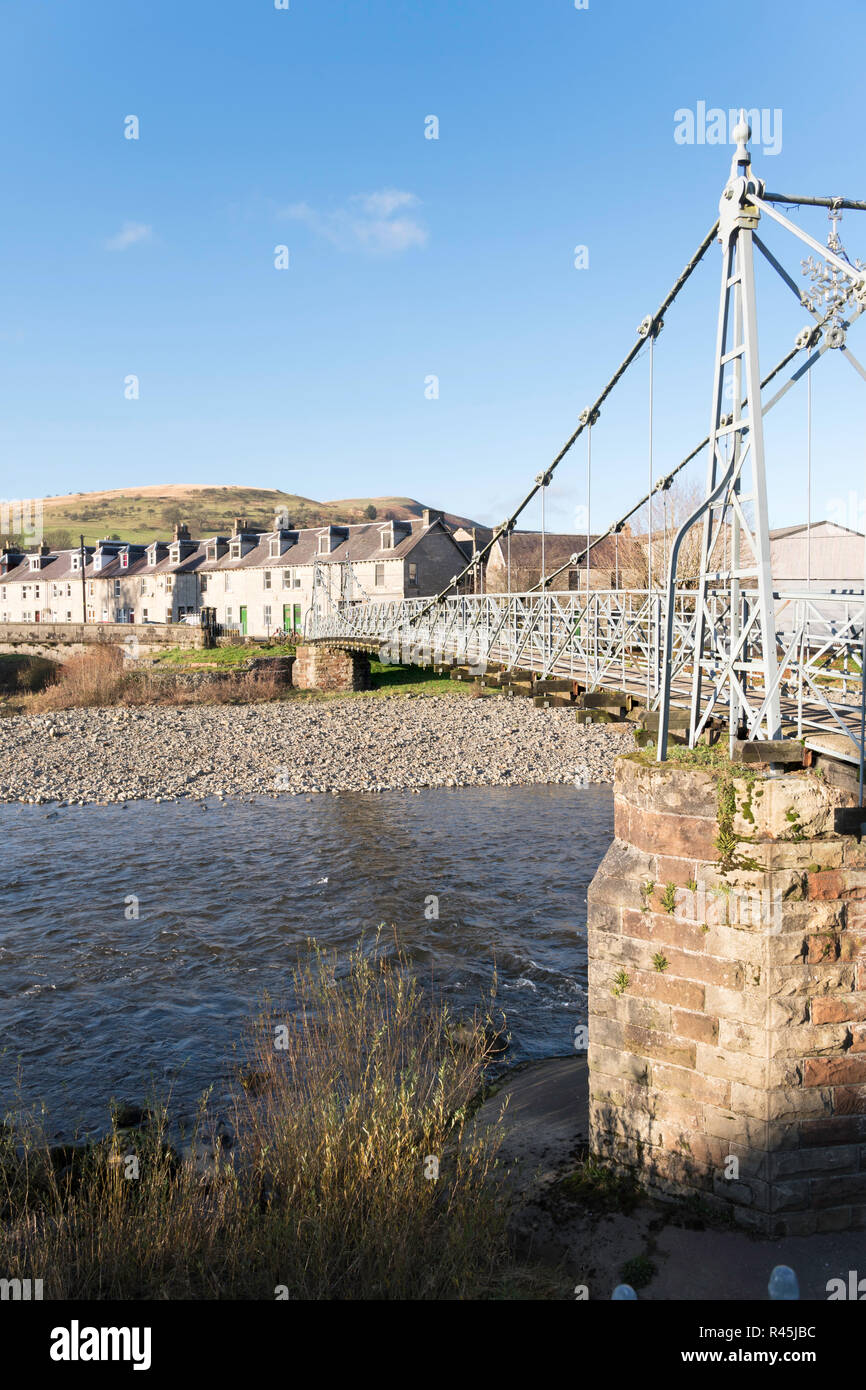 The listed Victorian suspension footbridge the Boatford Bridge over the river Esk, Langholm, Dumfries and Galloway, Scotland, UK Stock Photo