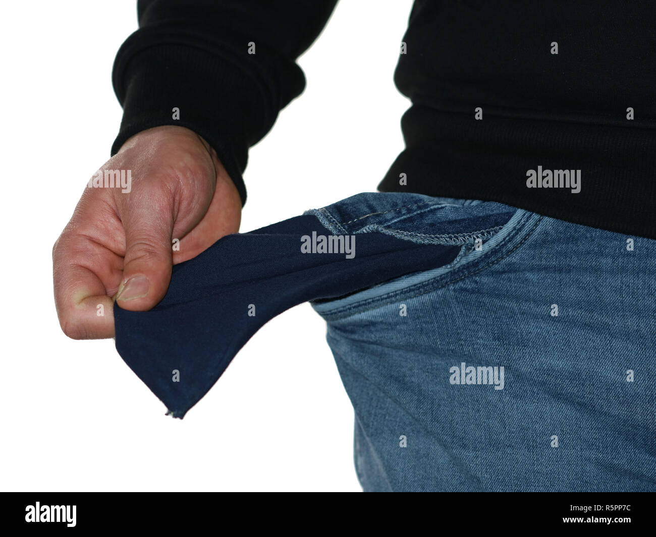 close up of poor man in jeans showing his empty pocket isolated on white background Stock Photo