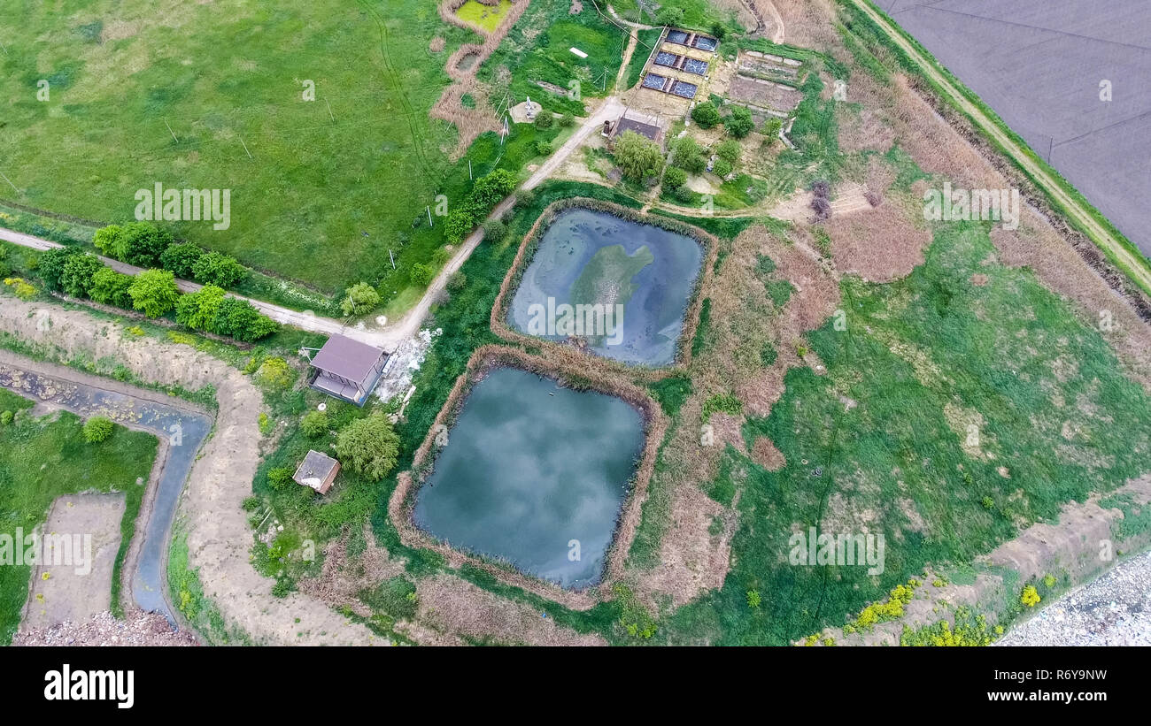 Purification facilities, sewage treatment pools. Landfill of garbage outside the village Stock Photo