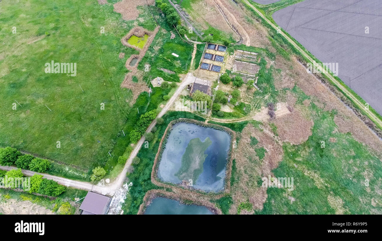 Purification facilities, sewage treatment pools. Landfill of garbage outside the village Stock Photo