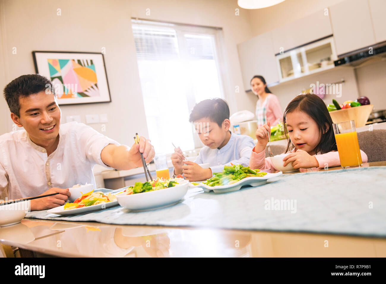 Happy family at dinner Stock Photo