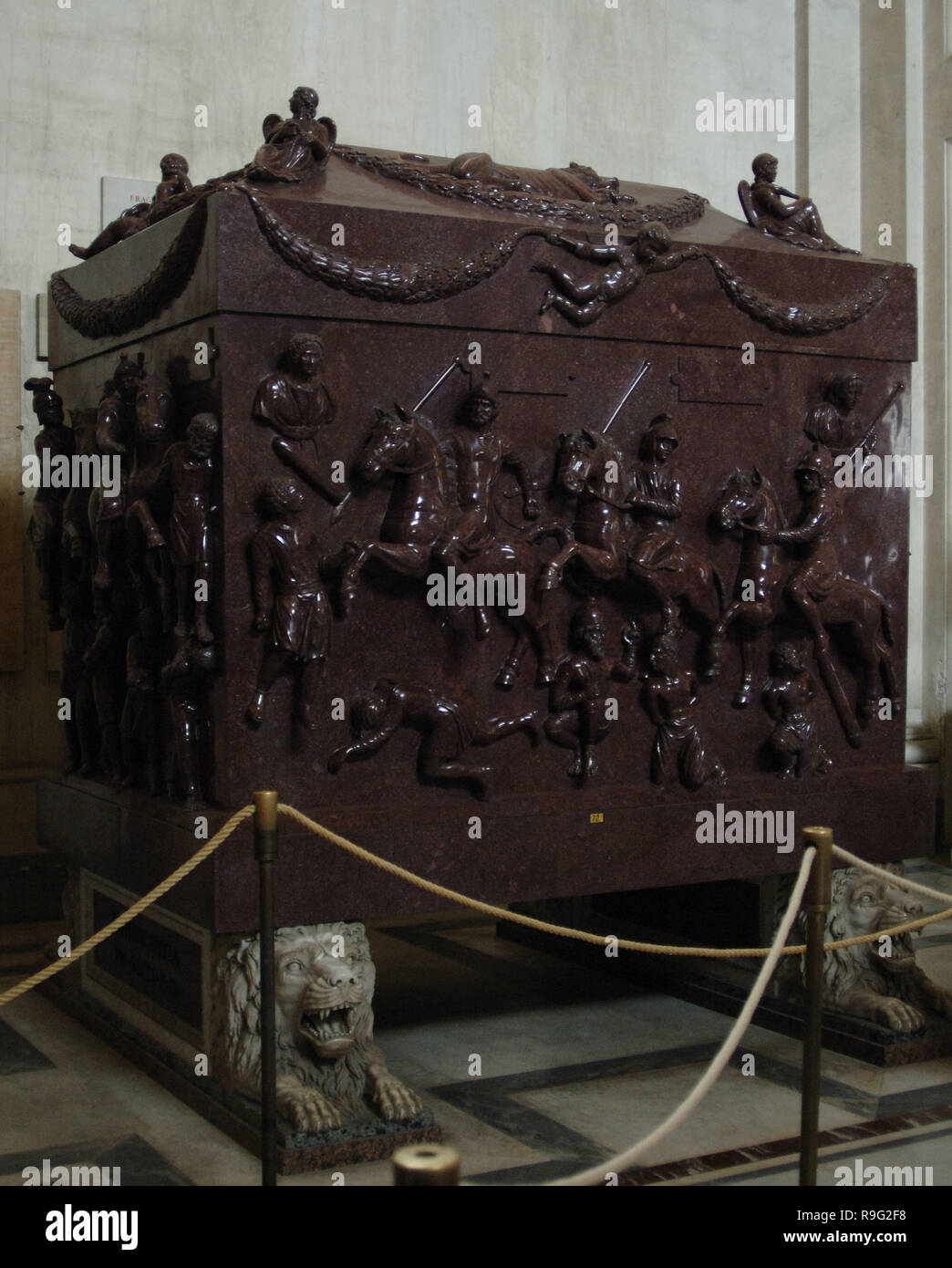 Roman Art. Italy. The sarcophagus of Helena. Red porphyry. 4th century. Carved with military scenes with Roman soldiers on horseback and barbarian prisoners. Mounted on four lions carved by Francesco Antonio Franzoni. It comes from Mausoleum of Helena. Pio-Clementino Museum. Vatican Museums. Vatican City. Stock Photo