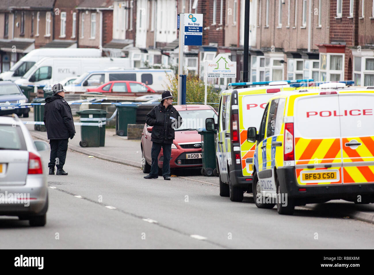 Police pictured in Burnaby Road, Coventry shortly after Police shot dead Sean Fitzgerald at a property in the street. Stock Photo