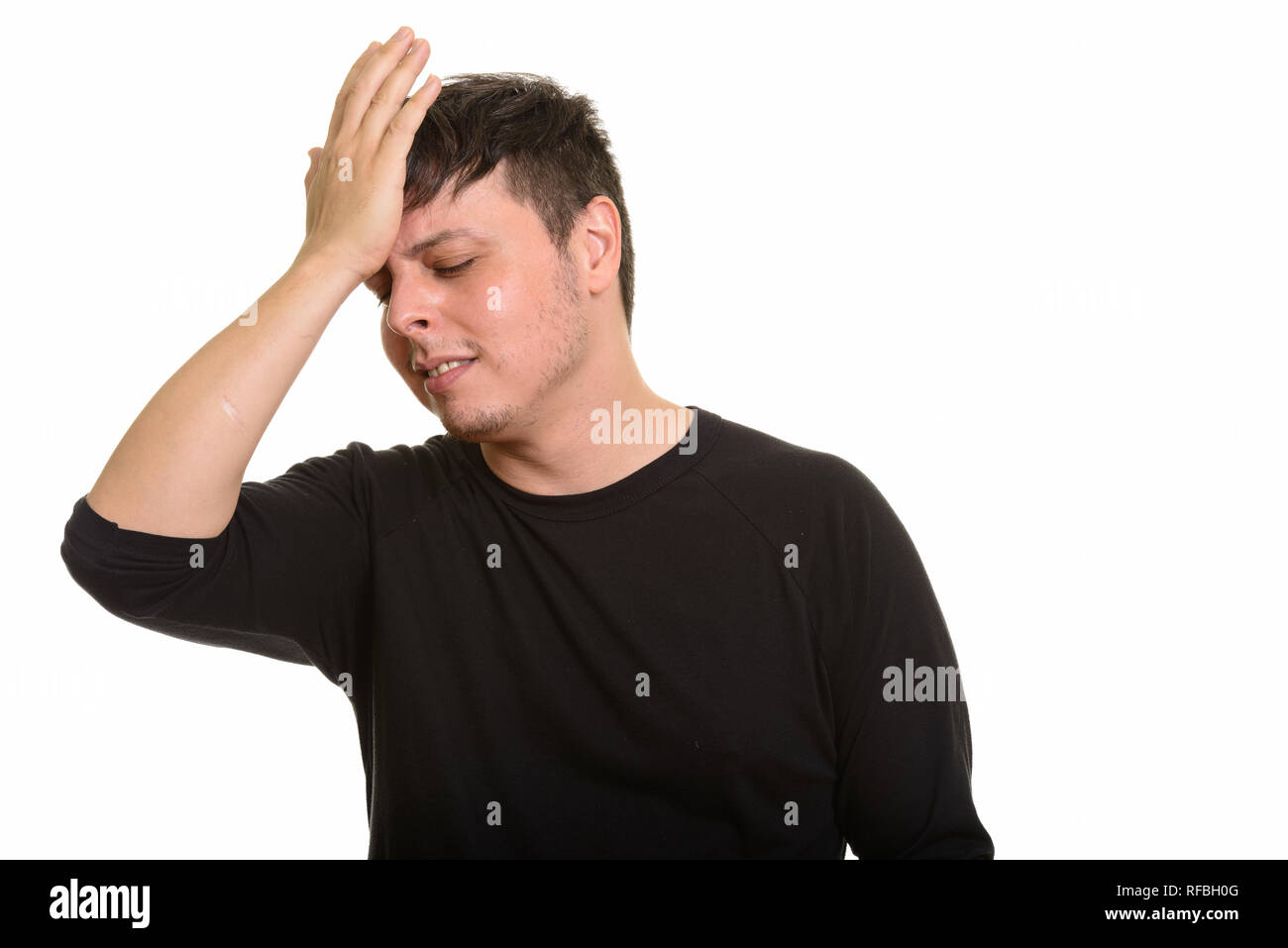 Studio shot of Caucasian man looking disappointed Stock Photo