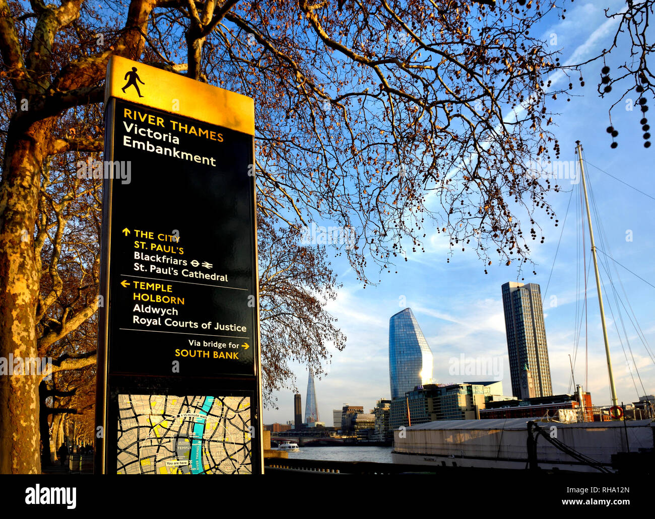 London, England, UK. River Thames, tourist information map and buildings on the South Bank seen from the Victoria Embankment. Stock Photo