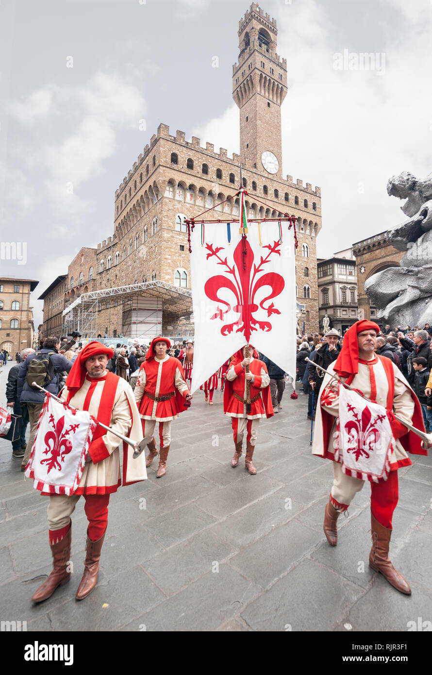 Standard bearer and trumpet player with historical coat of arms of Florence, parades in the Piazza della Signoria. Stock Photo