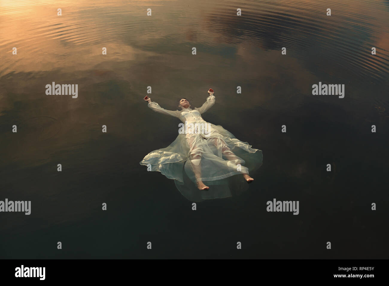 Dead maiden floating in lake waters Stock Photo