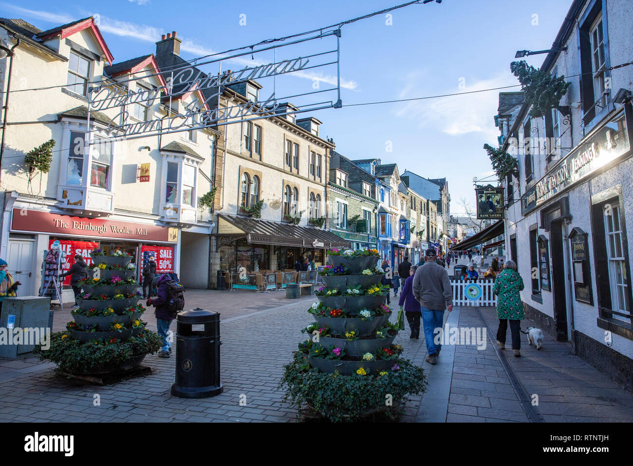 Christmas trees and merry christmas signs in Keswick town centre,Lake District,Cumbria,England Stock Photo