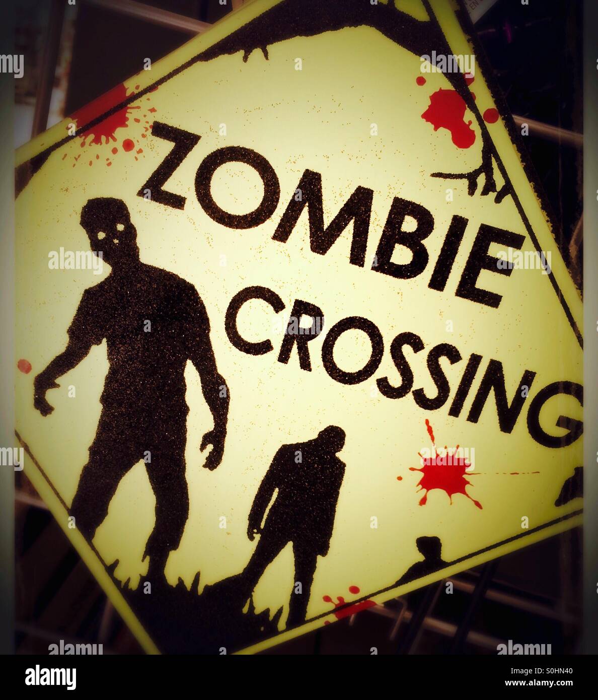 Zombie crossing Halloween sign Stock Photo