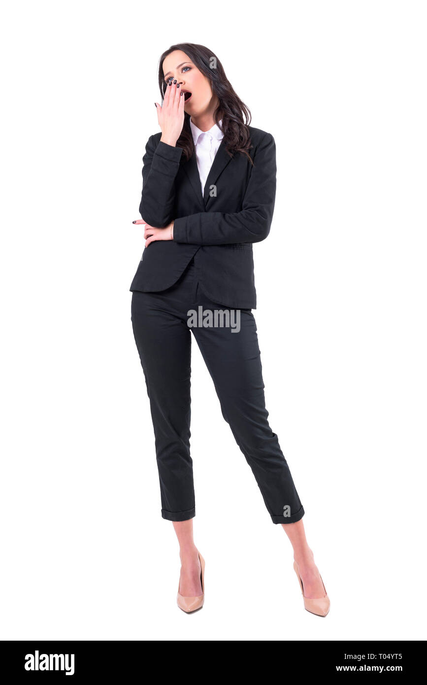 Bored business woman spectator on seminar or presentation yawning with hand on mouth. Full body isolated on white background. Stock Photo