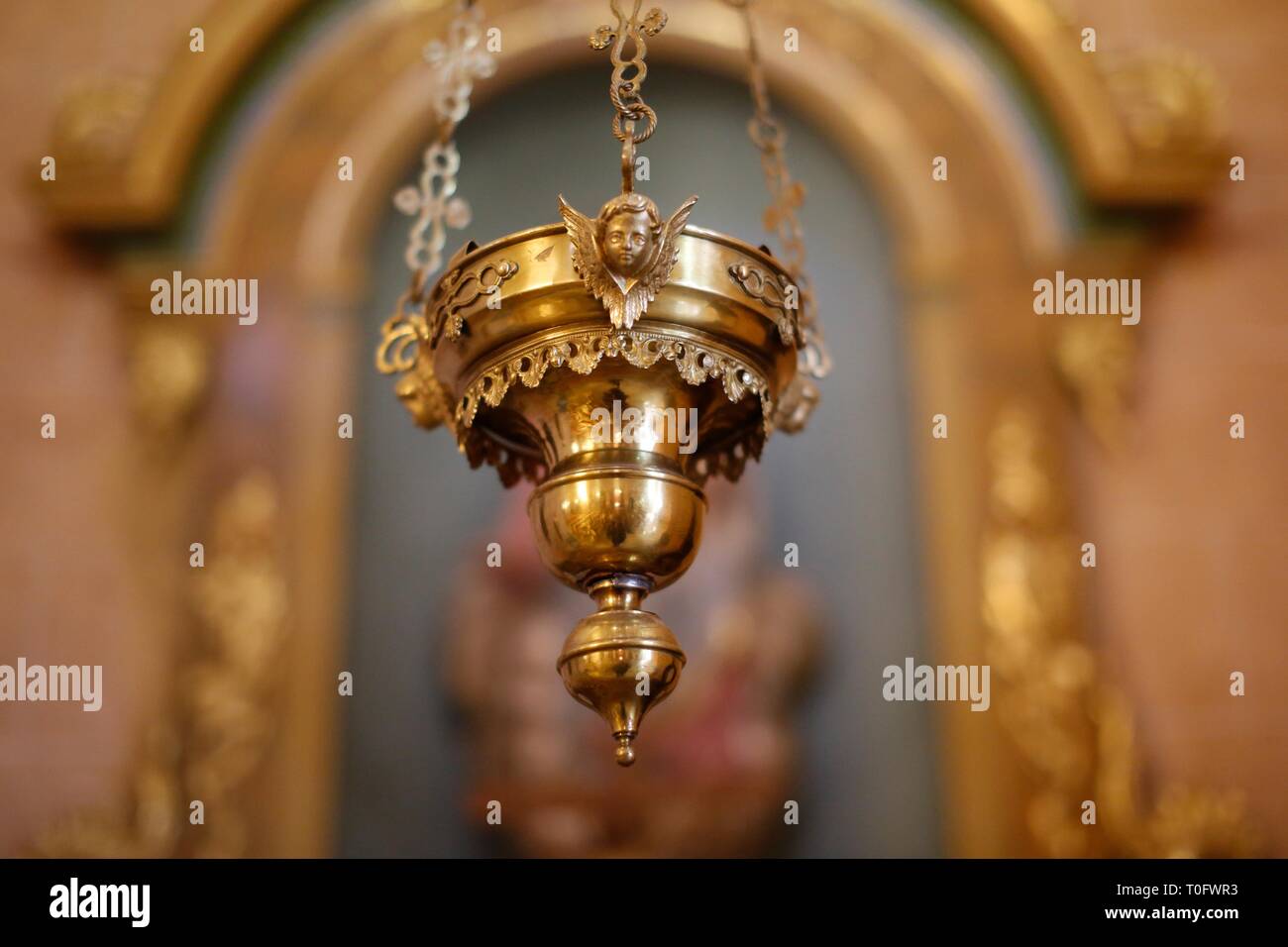 Close up of a Thurible Catholic incense burner hanging in a Spanish church Stock Photo