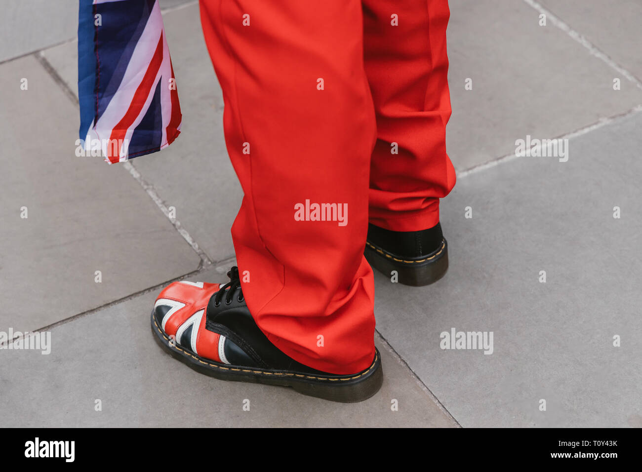 Brexit leave protester with Union Jack flag and red suit in Westminster London Stock Photo