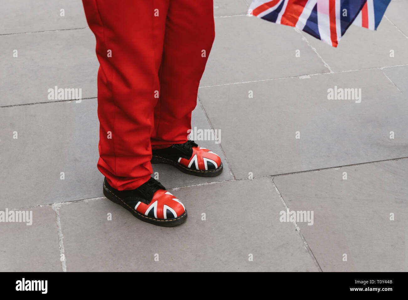 Brexit leave protester with Union Jack flag and red suit in Westminster London Stock Photo