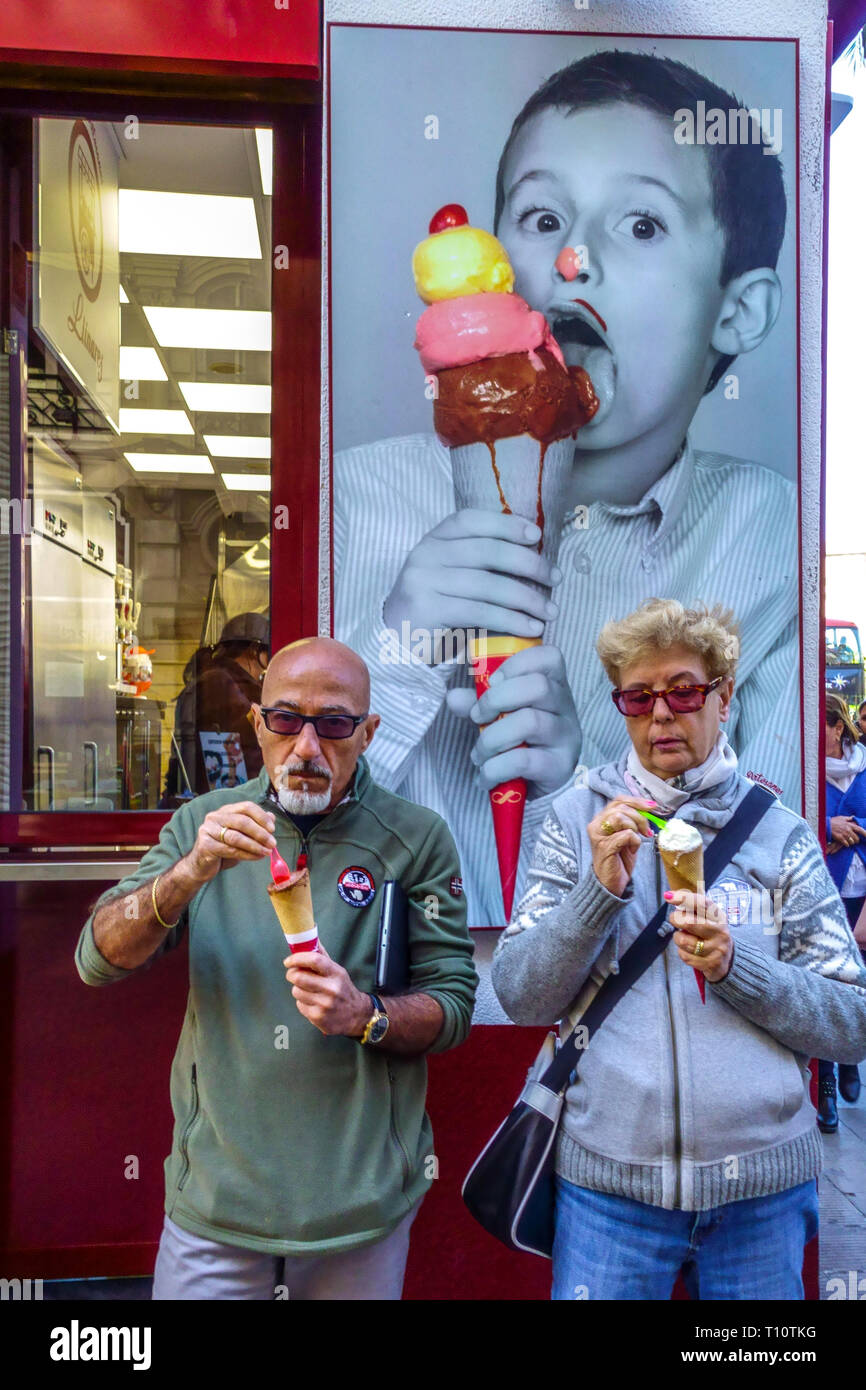 People Eating Ice Cream Spain Valencia tourists Senior Man woman Spain ice cream stand old people seniors senior ice cream shop Stock Photo