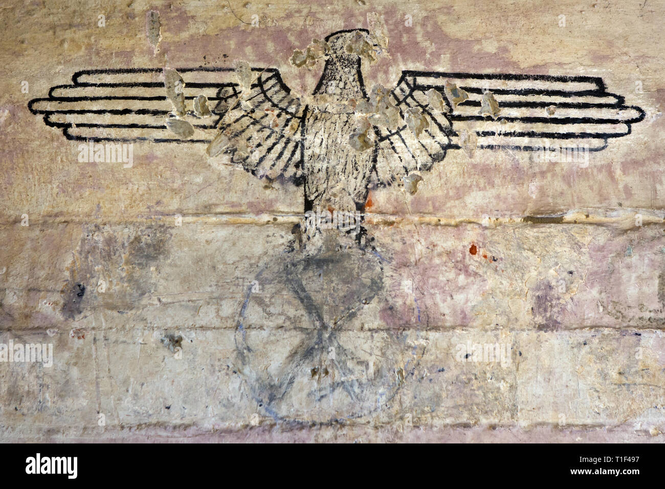 THE HAGUE - German eagle logo with erased swastika in a bunker that used to be part of the atlantikwall close to the beach Stock Photo