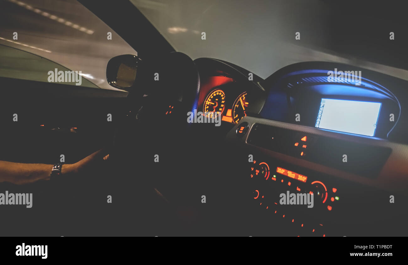 Vienna Austria March.22 2019, Young Men driving his BMW car, motion blurred night scene Stock Photo