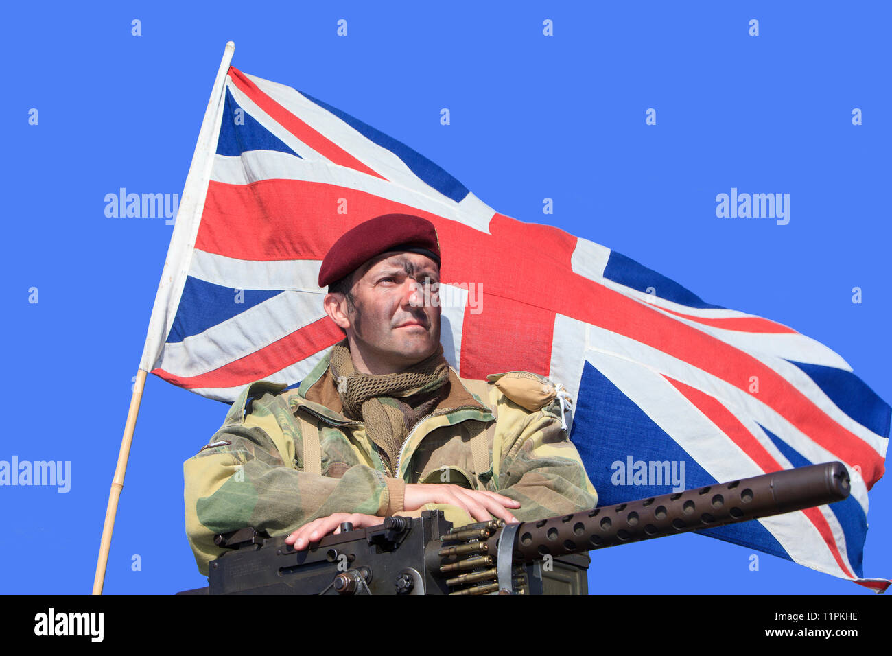 A soldier of the 1st Airborne Division of the British Parachute Regiment with a Browning .30 Calibre during D-Day celebrations in Normandy, France Stock Photo