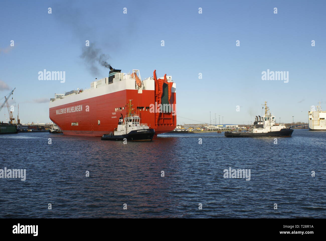 Towing in Bremerhaven port. Stock Photo