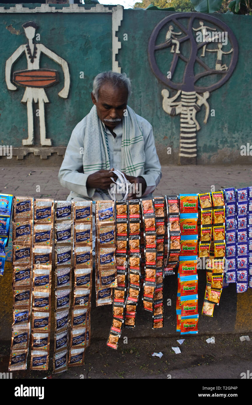 Street vendor selling packets of pan masala, gutka,... ( India) Stock Photo