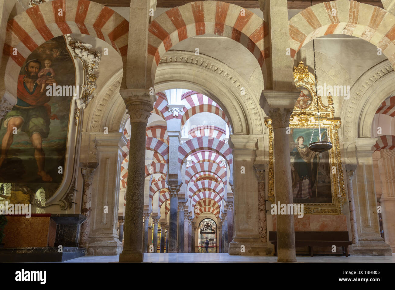 interior view of the mosque in cordoba with its many archways Stock Photo