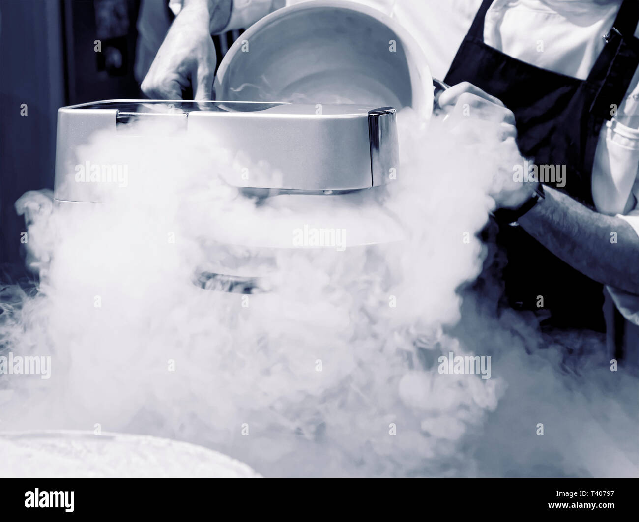 Chef is making ice cream with liquid nitrogen Stock Photo