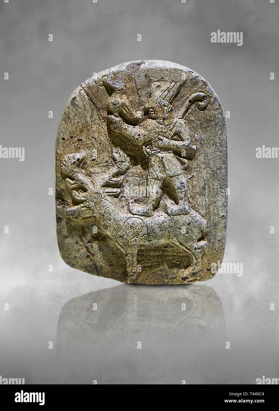 Plaque depicting the Hittite Protector of the wild standing on the back of a deer. Steatite - 14th - 13th century BC - Corum Yenikoy  - Museum of Anat Stock Photo