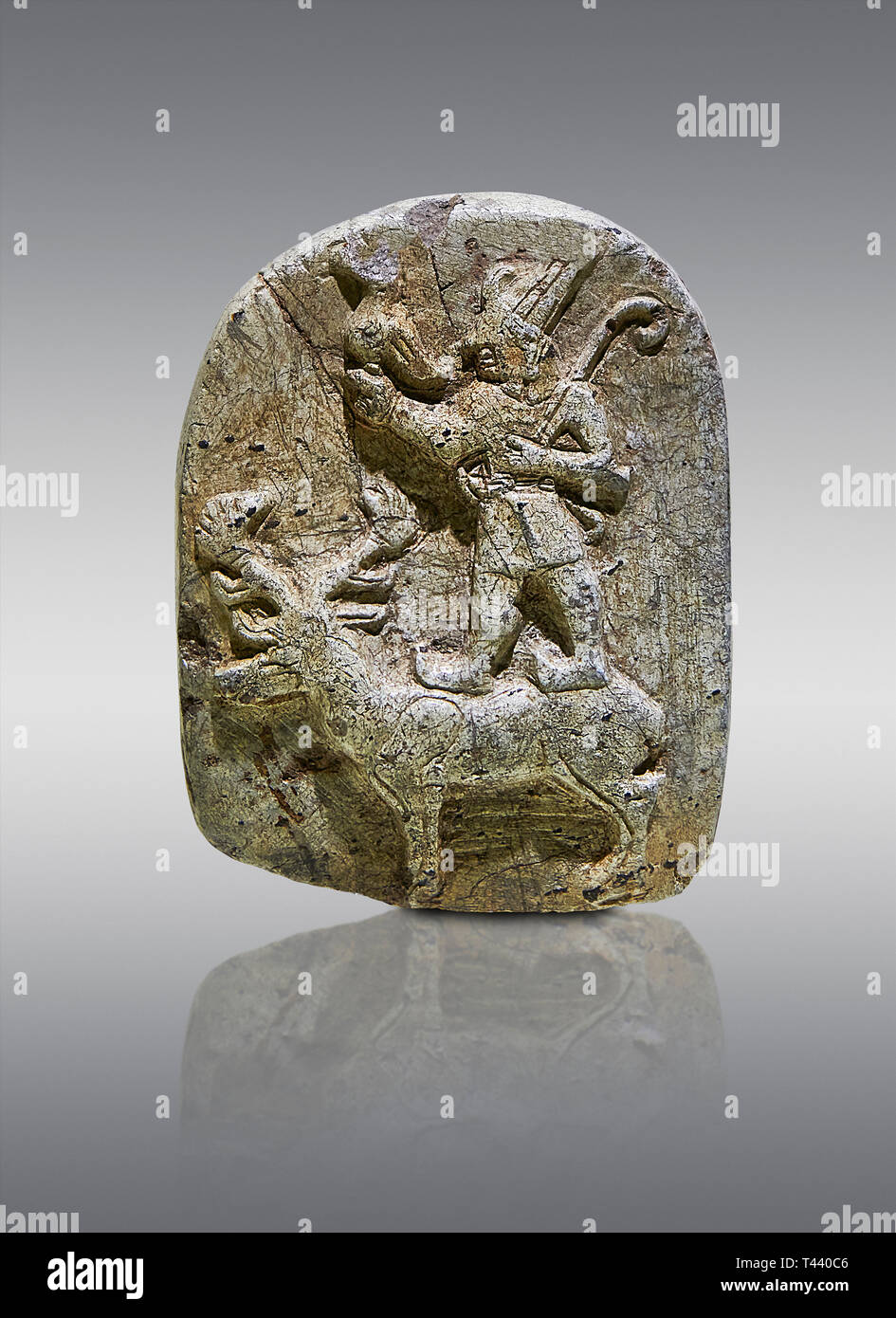 Plaque depicting the Hittite Protector of the wild standing on the back of a deer. Steatite - 14th - 13th century BC - Corum Yenikoy  - Museum of Anat Stock Photo