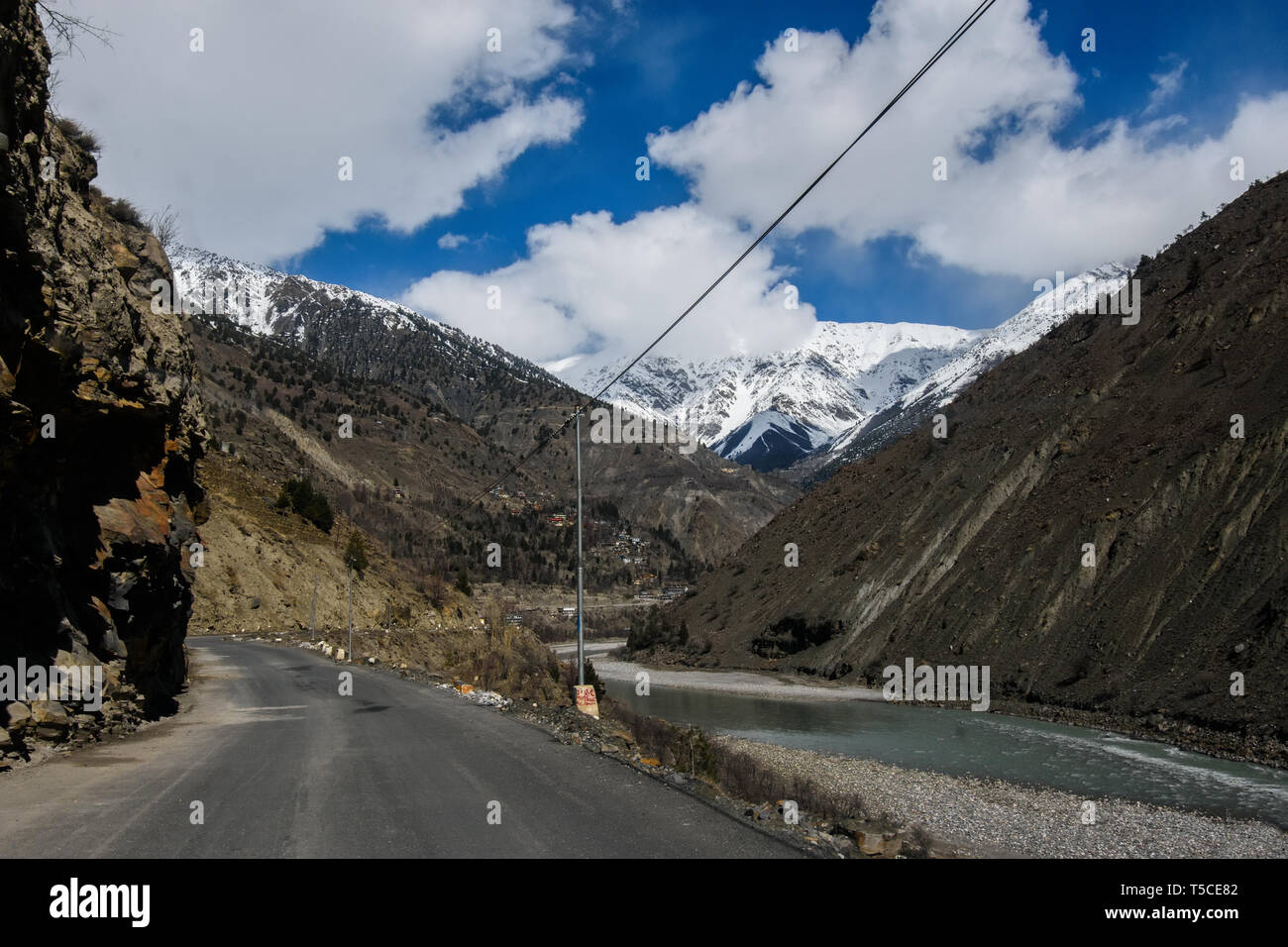 Winter drive to beautiful & lonely snow planet in Spiti Valley, Himachal Pradesh, India - most dangerous roads in the world, icy slippery roads Stock Photo