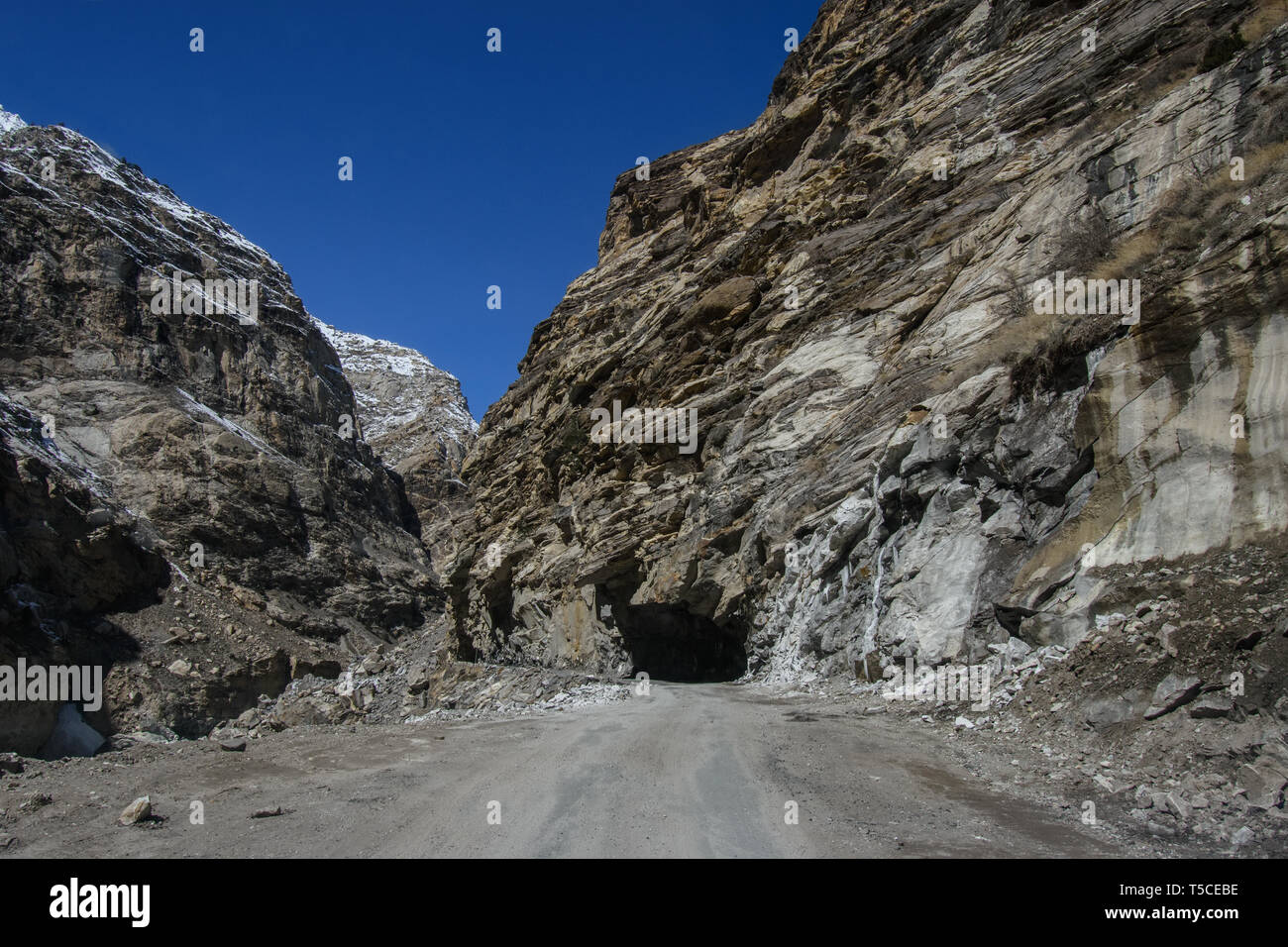 Winter drive to beautiful & lonely snow planet in Spiti Valley, Himachal Pradesh, India - most dangerous roads in the world, icy slippery roads Stock Photo