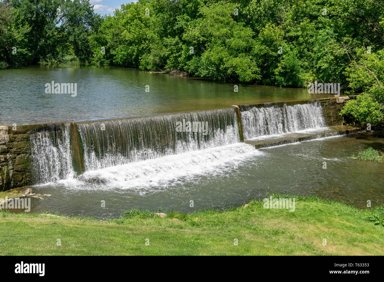 Amish Countryside with a Man Made Waterfall by a Mill Stock Photo