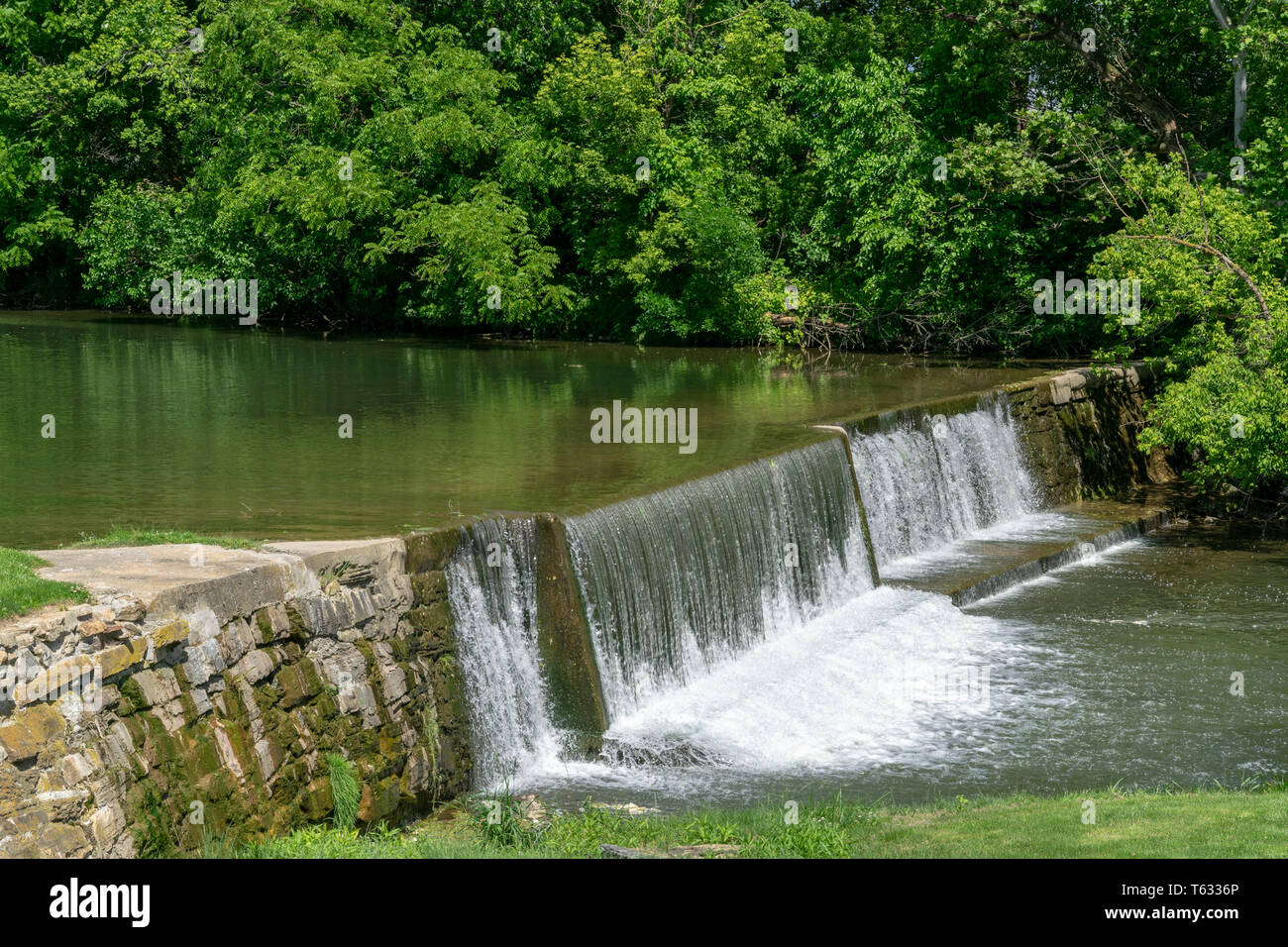 Amish Countryside with a Man Made Waterfall by a Mill Stock Photo